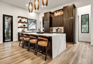 Modern kitchen remodel with wood cabinets, large island, and pendant lighting